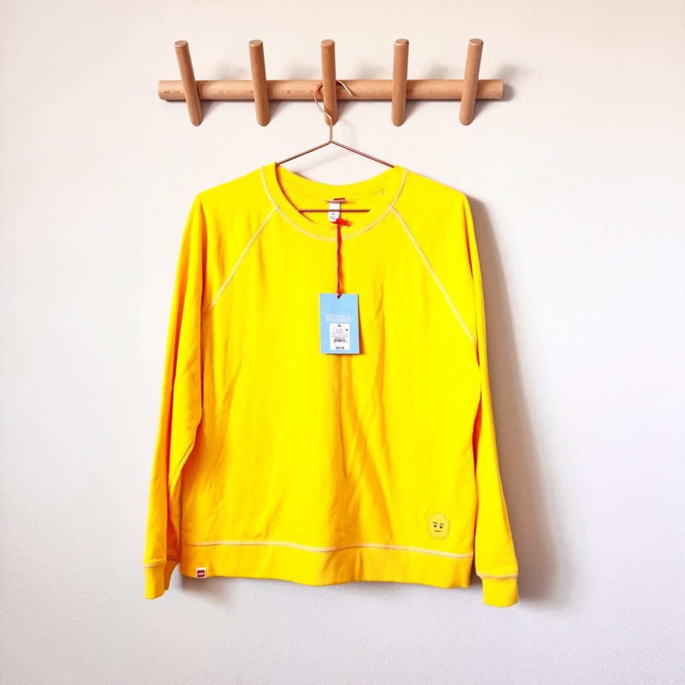 Lego x Target bright yellow mini figure sweatshirt.